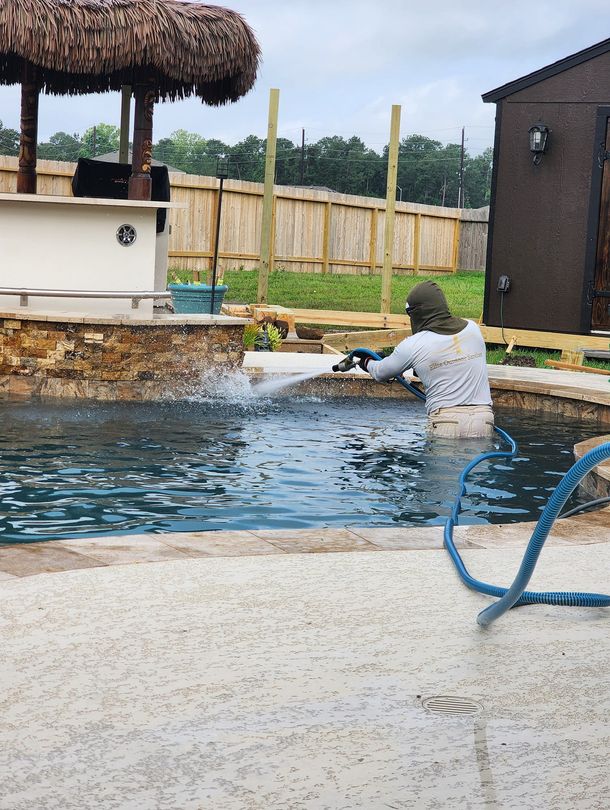 man cleaning a pool