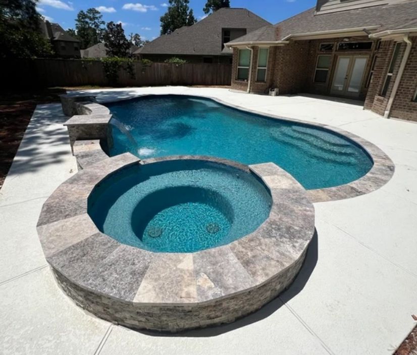 white concrete deck pool with stone walls